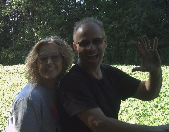 Mark and Tammy Tompkins together outdoors at the farm