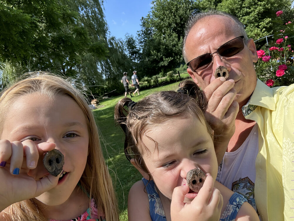 Grandchildren digging into a farm meal