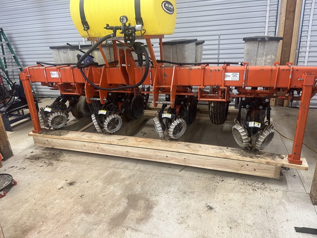 The Tompkins Farm no-till planter with row units for drilling into clover