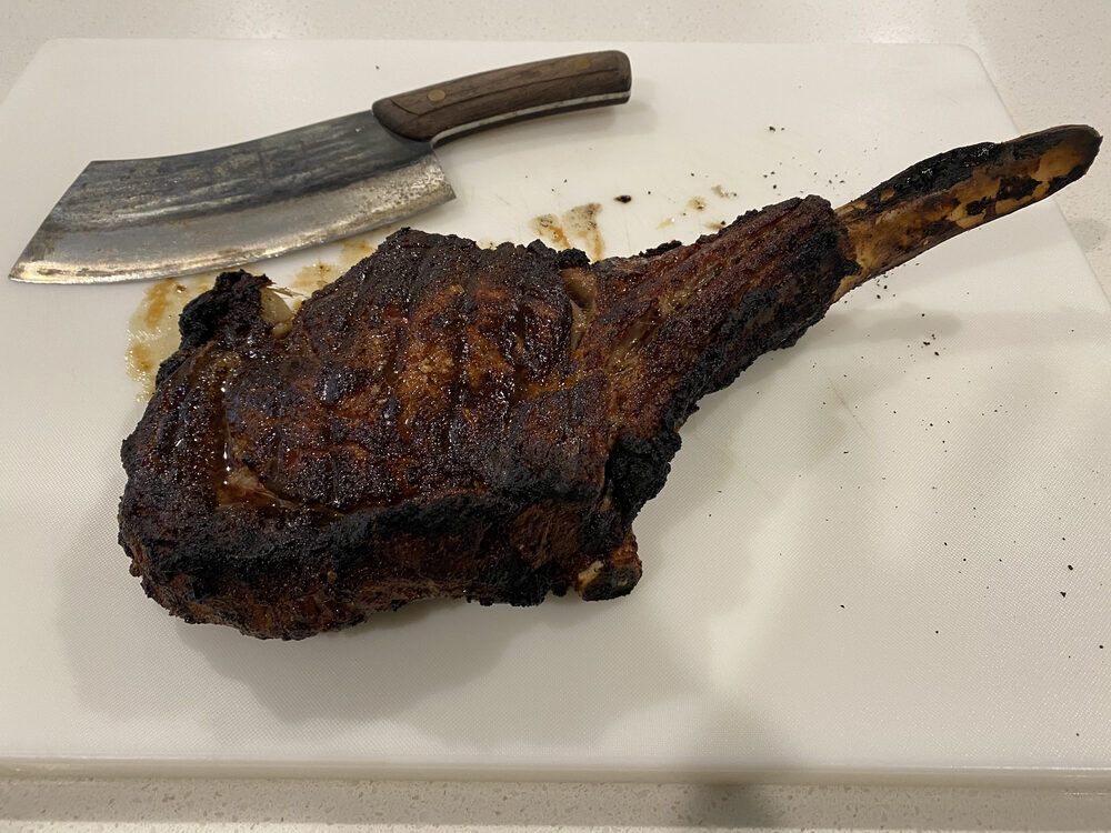 A reverse-seared tomahawk steak on the board